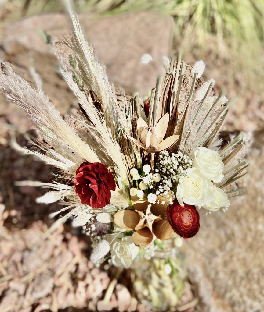 A close up of a bouquet of flowers in a vase.