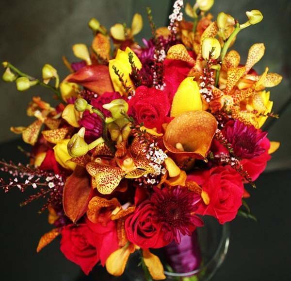 A bouquet of red and yellow flowers in a vase