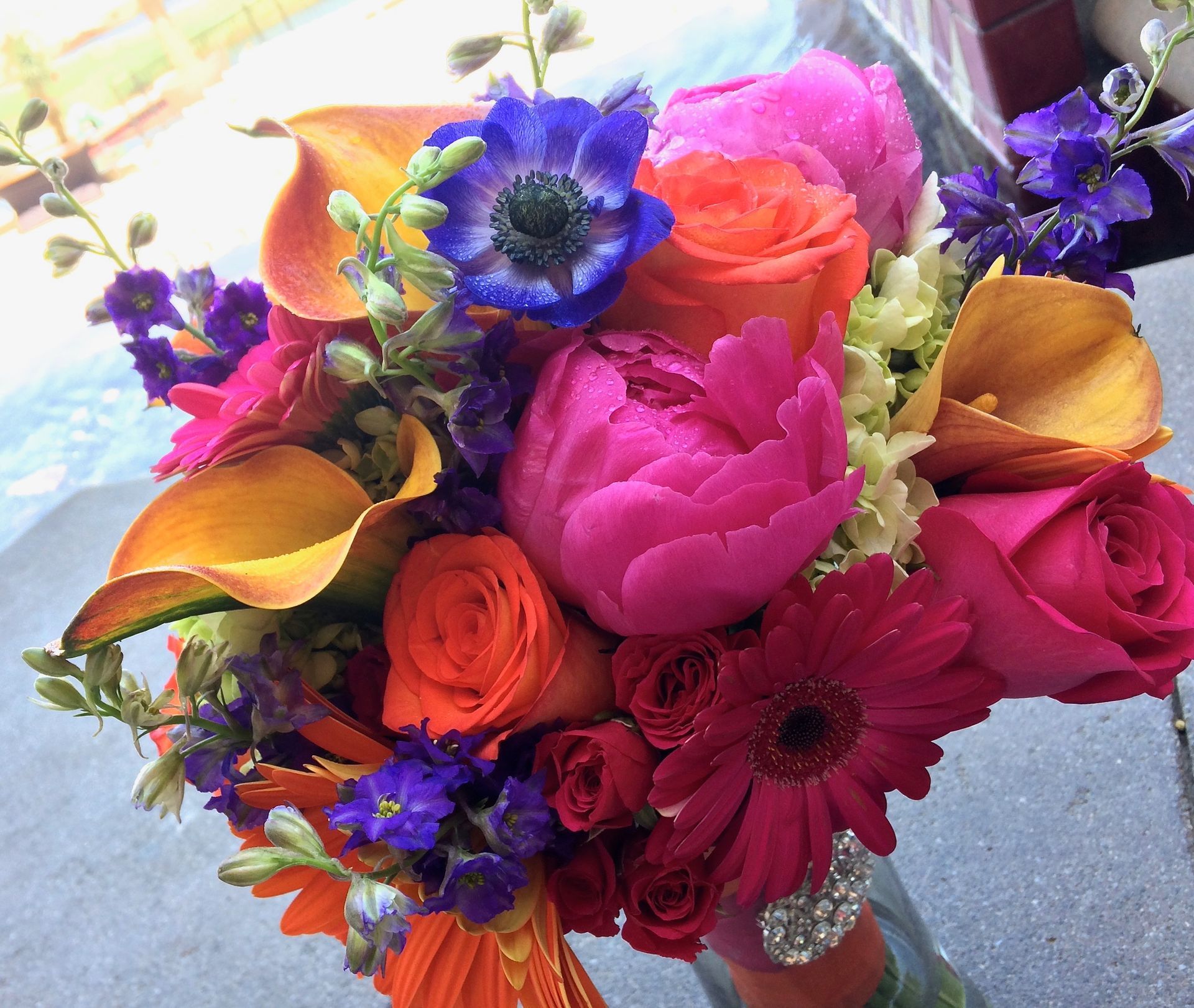 A bouquet of brightly colored flowers in a vase
