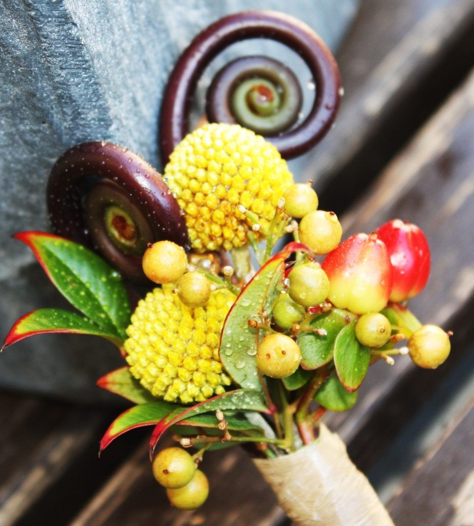 A close up of a bouquet of yellow and red flowers
