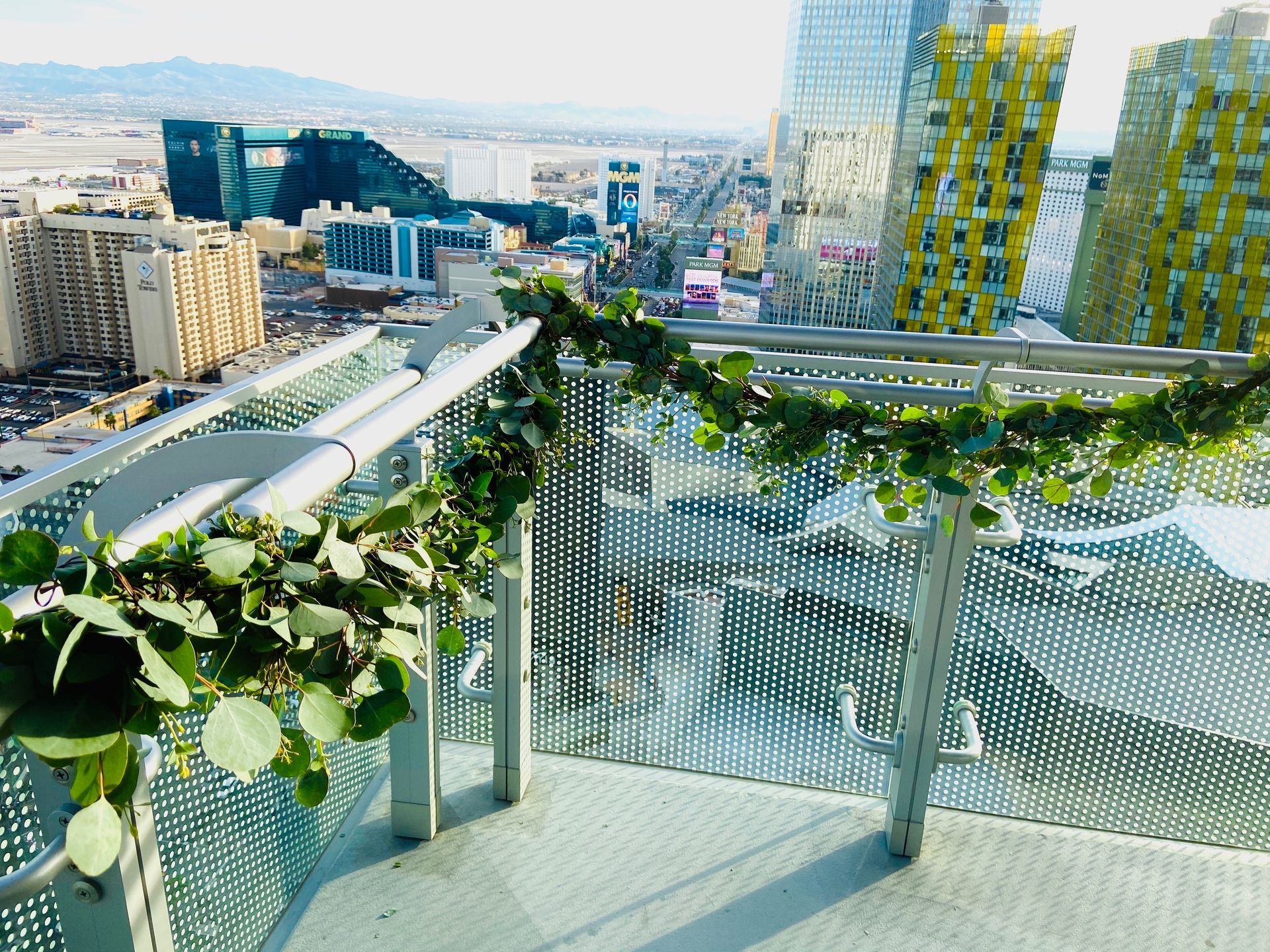 There is a balcony with a view of the city.