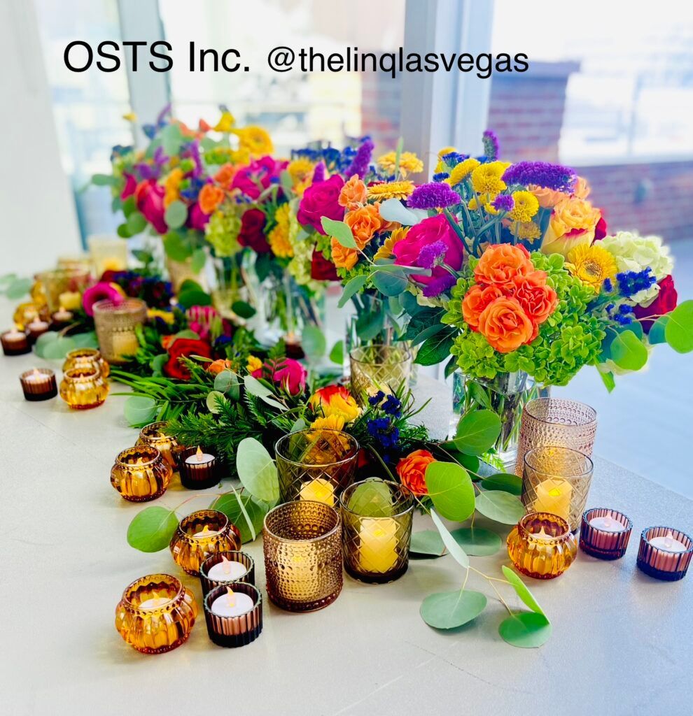 A table decorated with flowers and candles by osts inc.