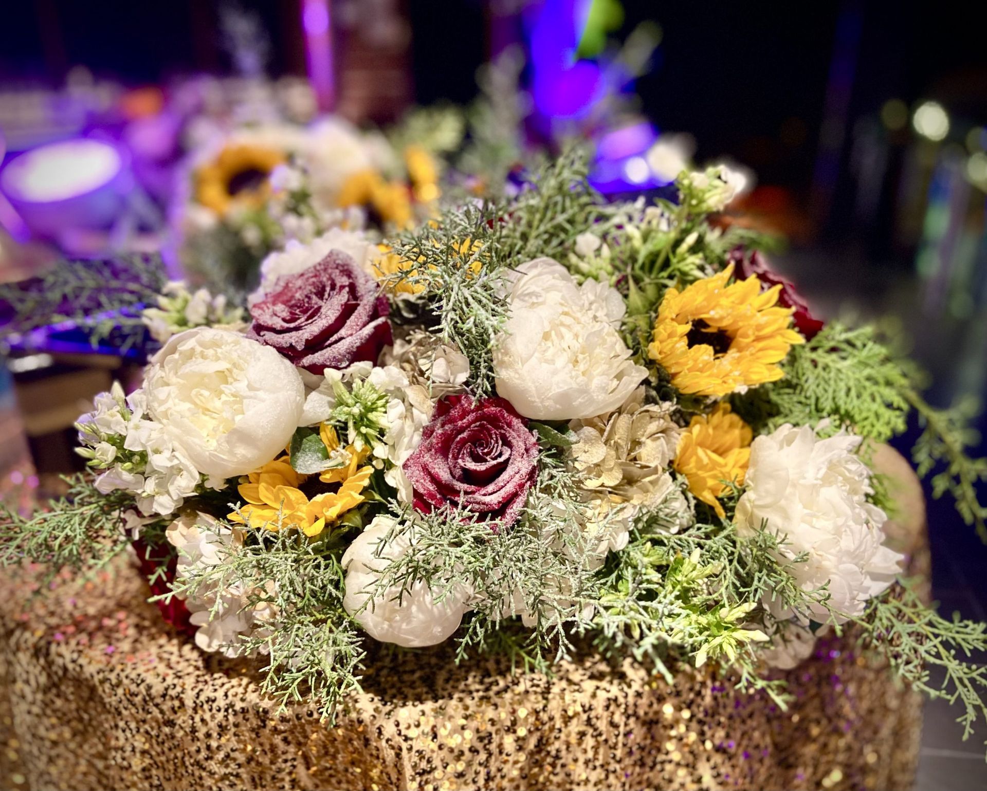 A bunch of flowers are sitting on top of a table.
