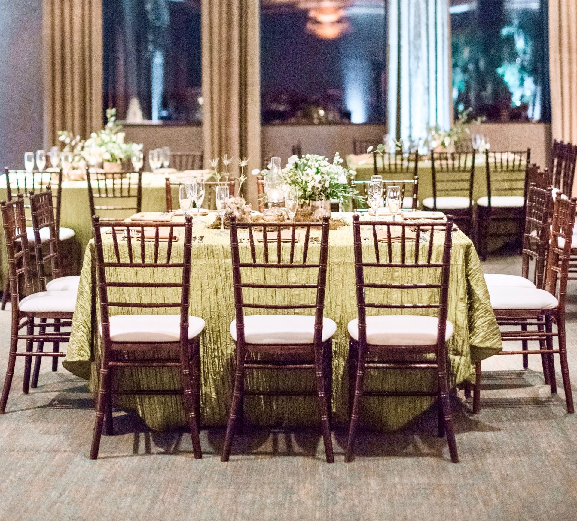 Tables and chairs are set up for a wedding reception