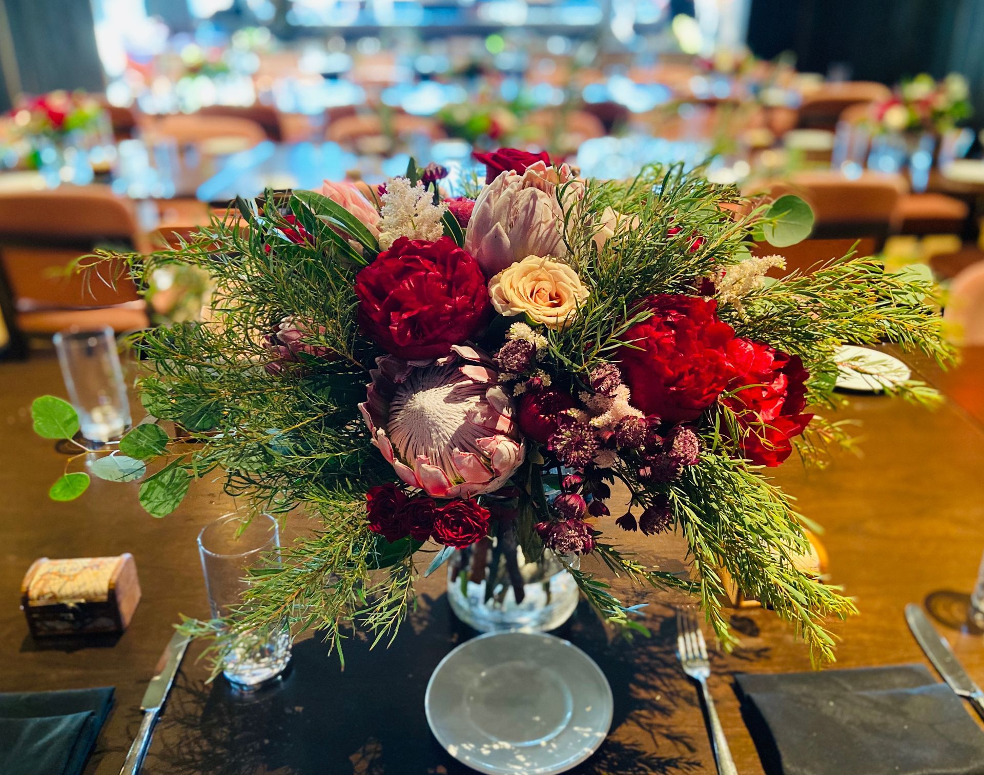 A vase filled with flowers is sitting on a table.