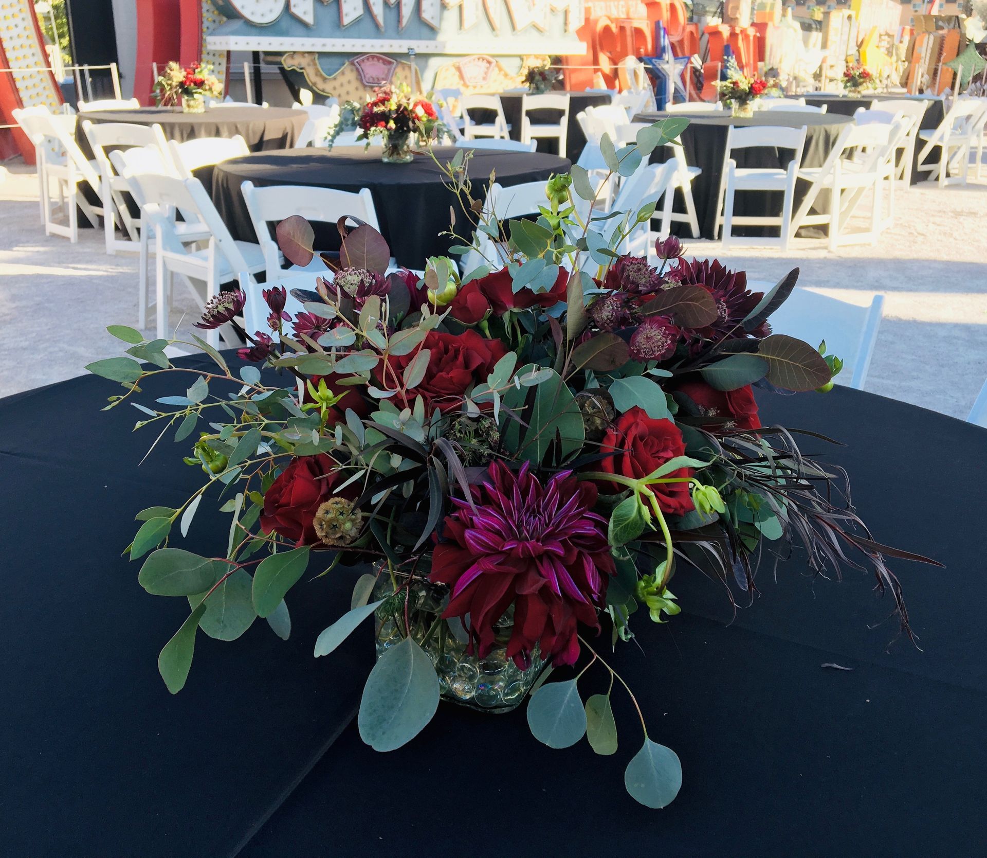 A table with a vase of flowers on it