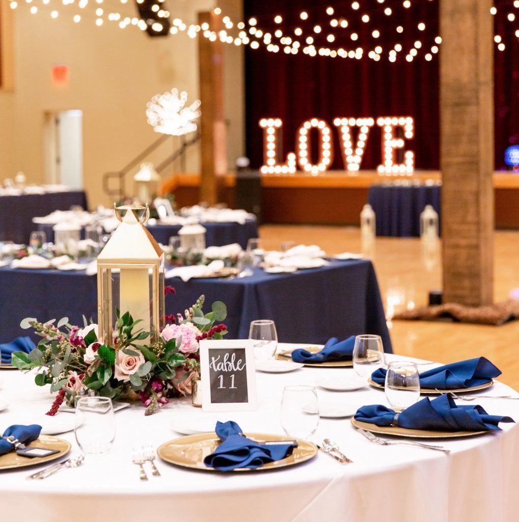 A room with tables and a sign that says love