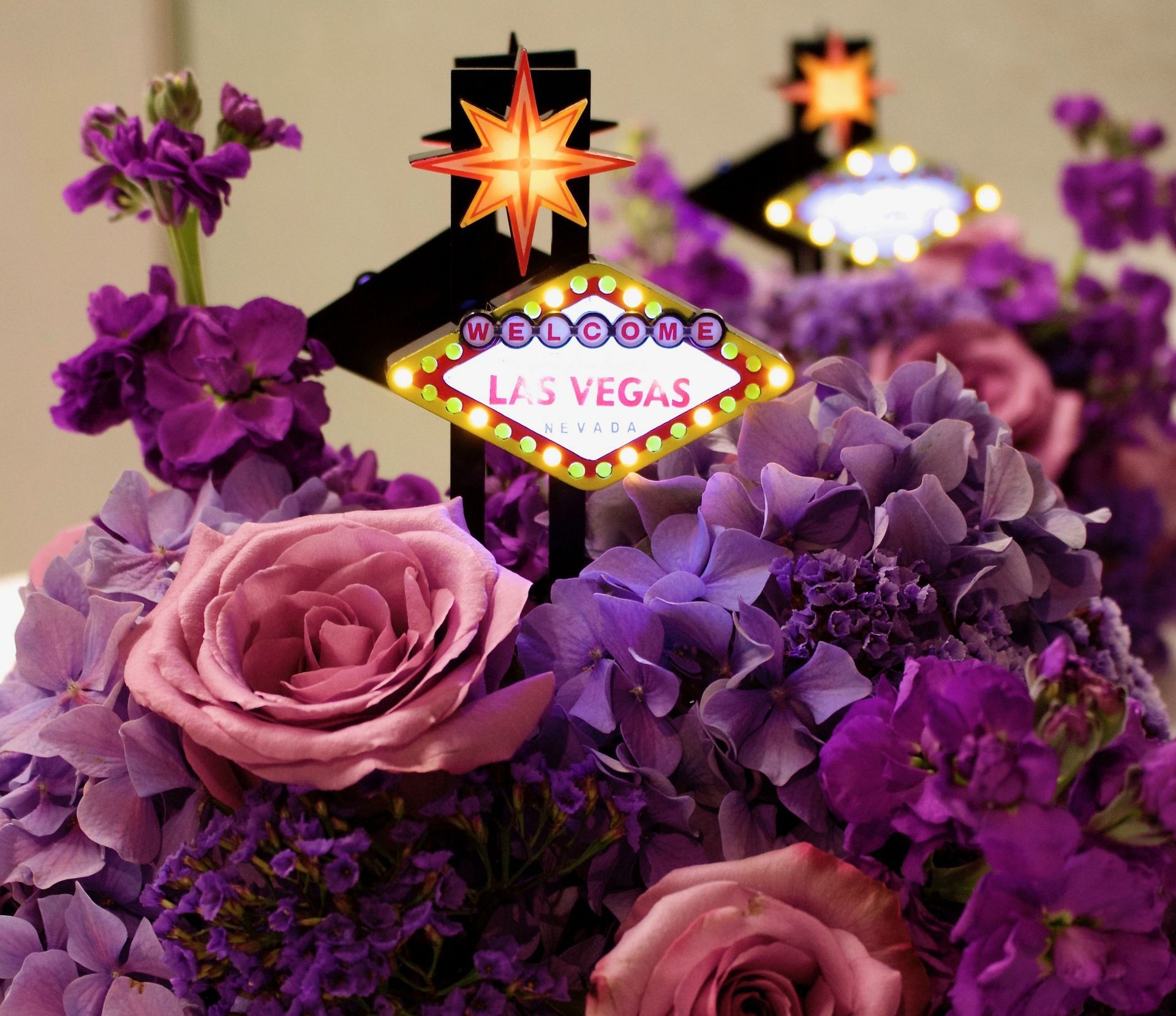 Purple flowers with a las vegas sign in the background