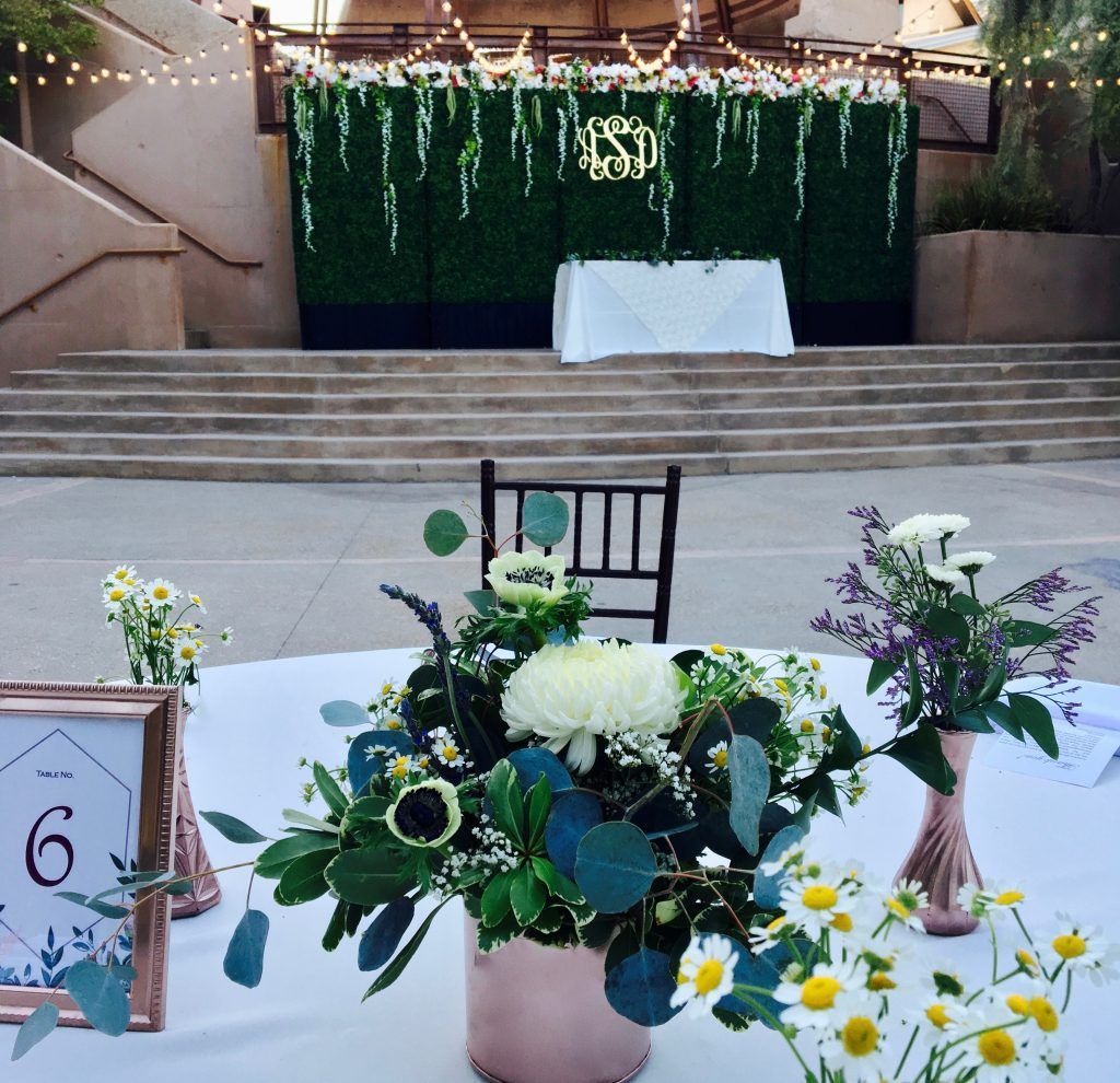 A table with flowers and a sign that says number 21