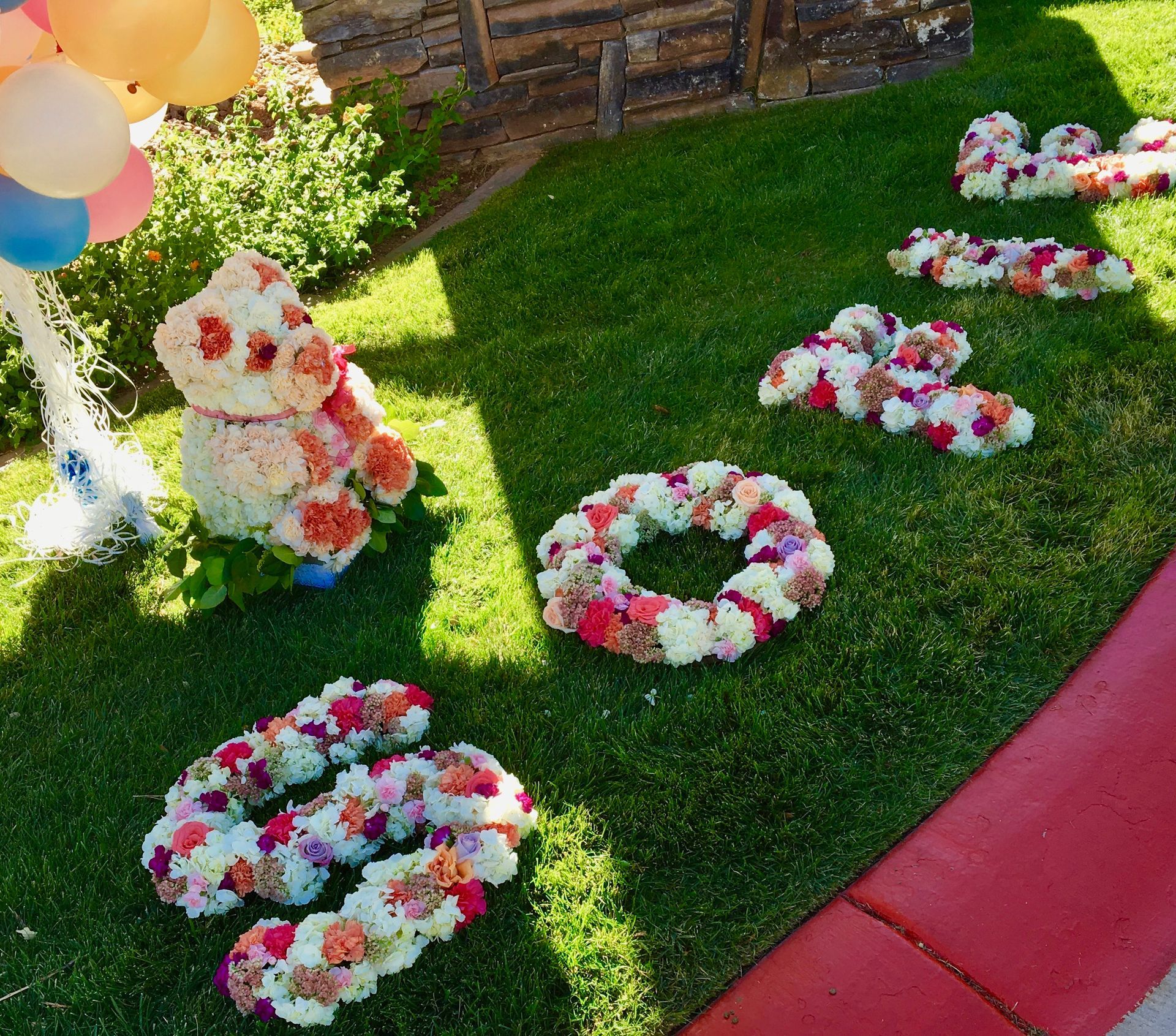 Flowers are arranged in the shape of the word love