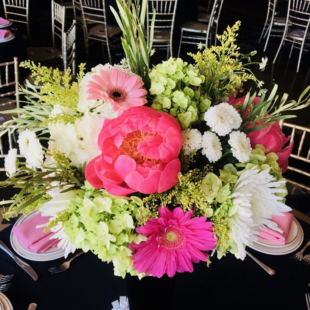 A table with a bunch of flowers on it
