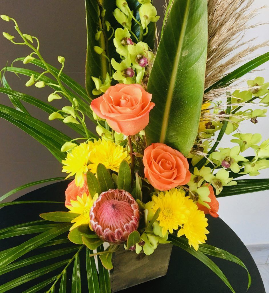 A bouquet of flowers in a vase on a table