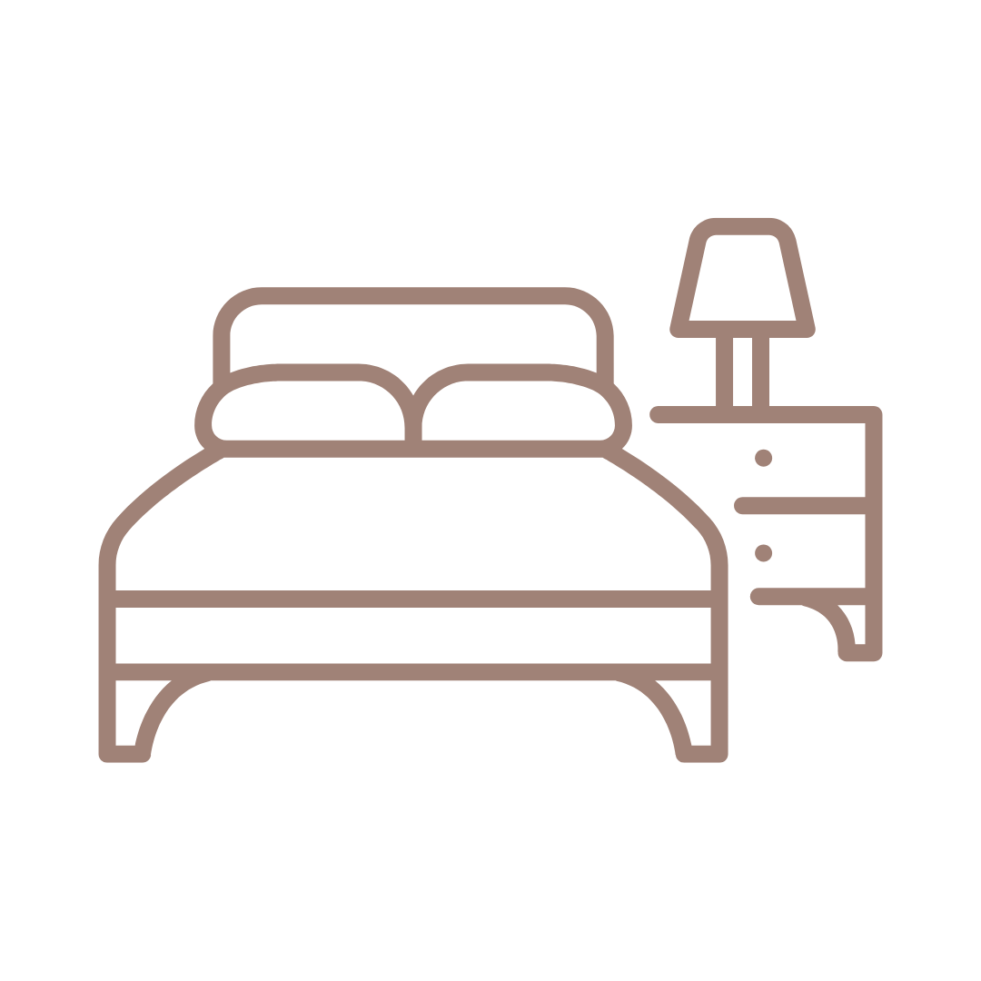 Un disegno a tratteggio di un letto e di un comodino con una lampada.