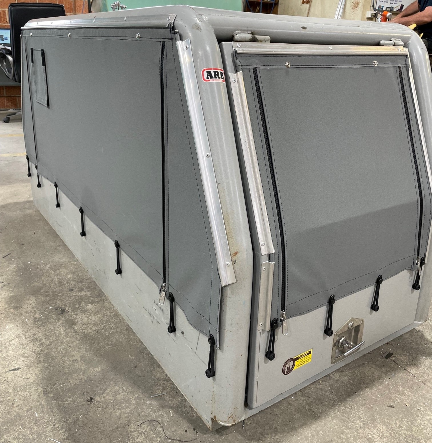 A Silver Ute Cage With A Grey Canopy — Simmons Glass & Trim In Bathurst, NSW