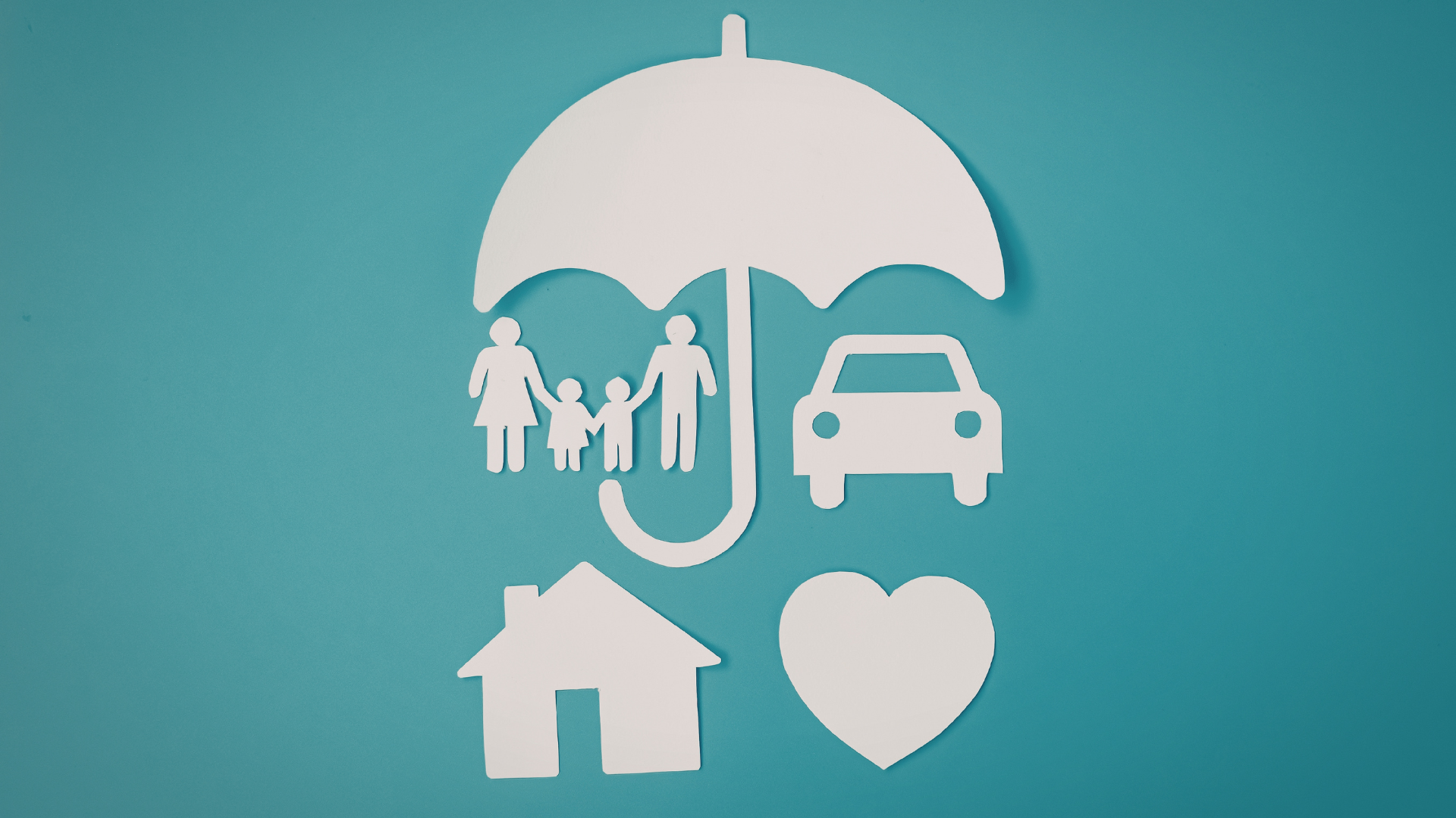 White paper cutouts of a family, car, house, heart, and umbrella on a teal background, symbolizing insurance coverage.