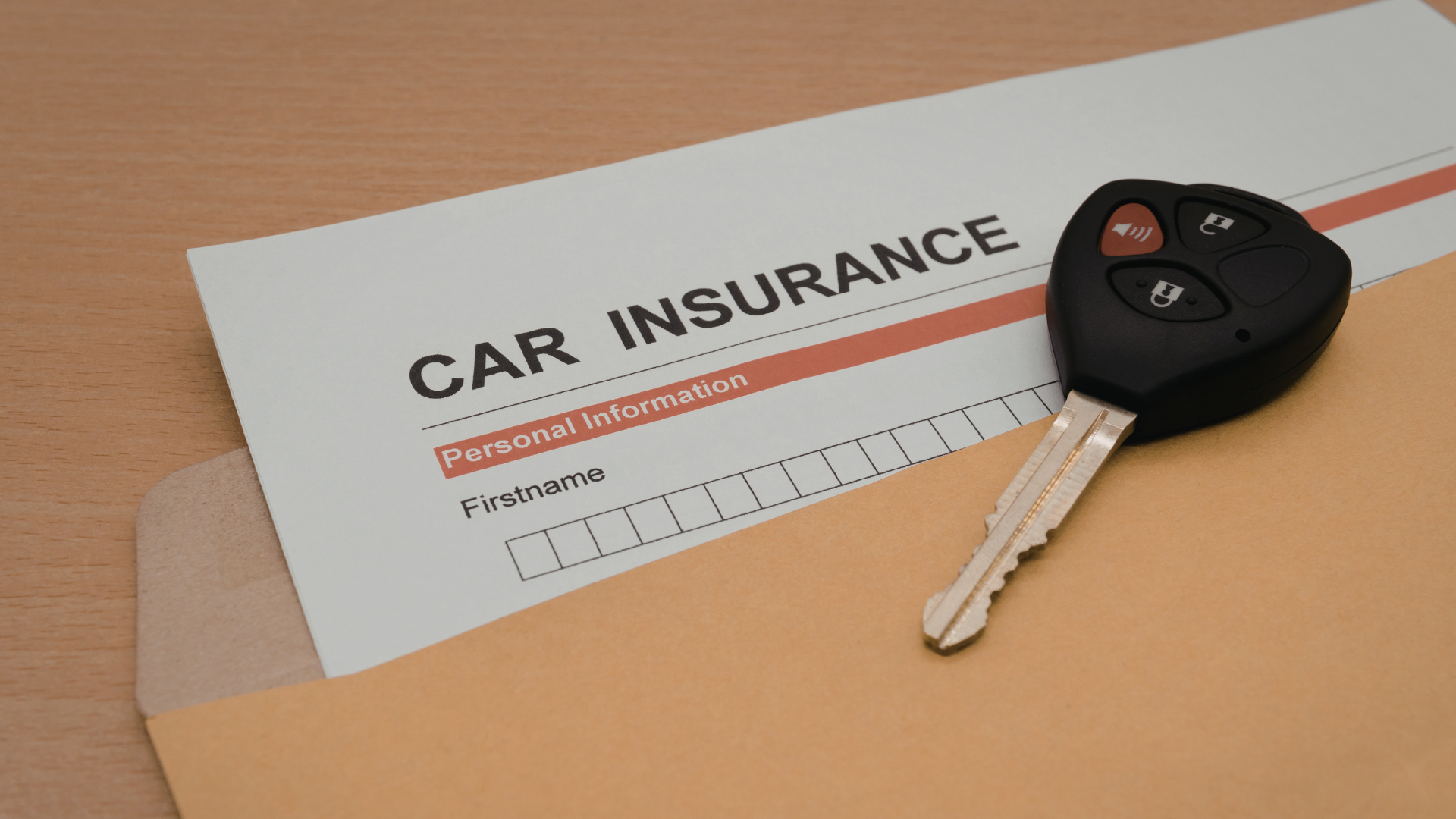 Car insurance document in an envelope with car key.