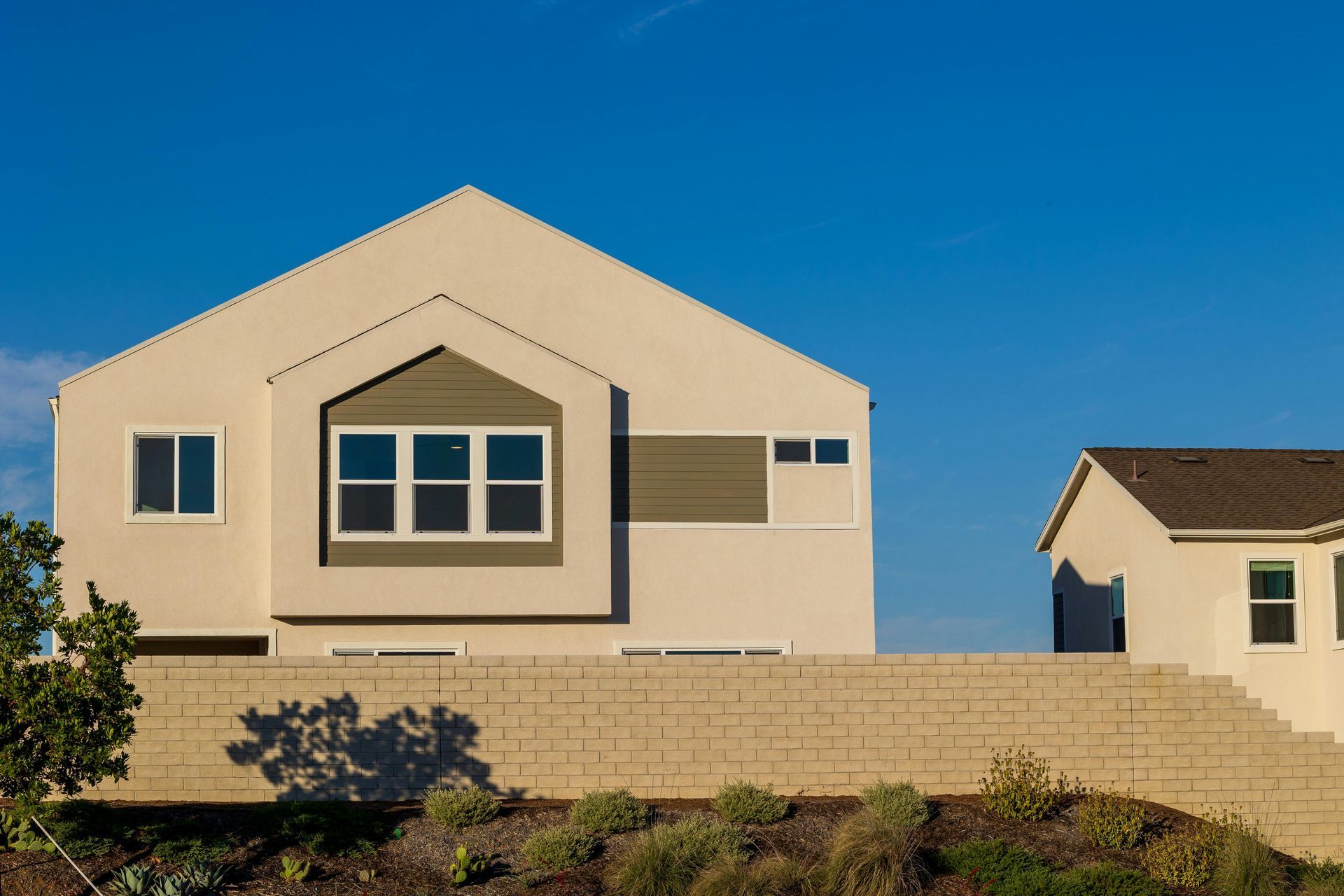 Tan two-story suburban home in Tempe Arizona representing local home insurance coverage options