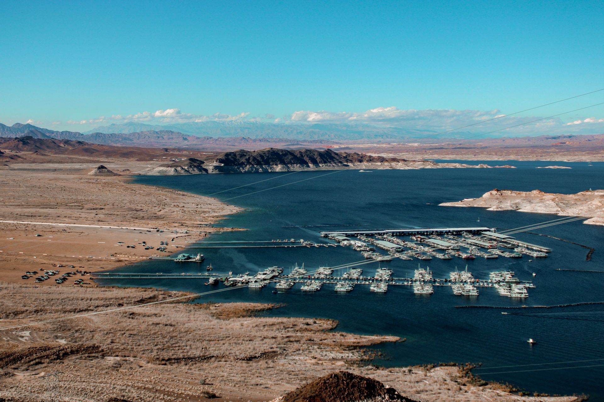 Aerial view of an Arizona lake marina full of moored boats, representing boat insurance for Arizona