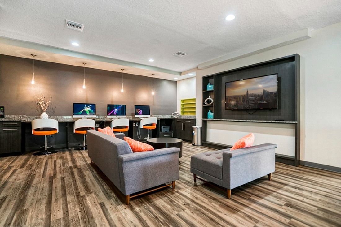 Community lounge with large screen tv and computers