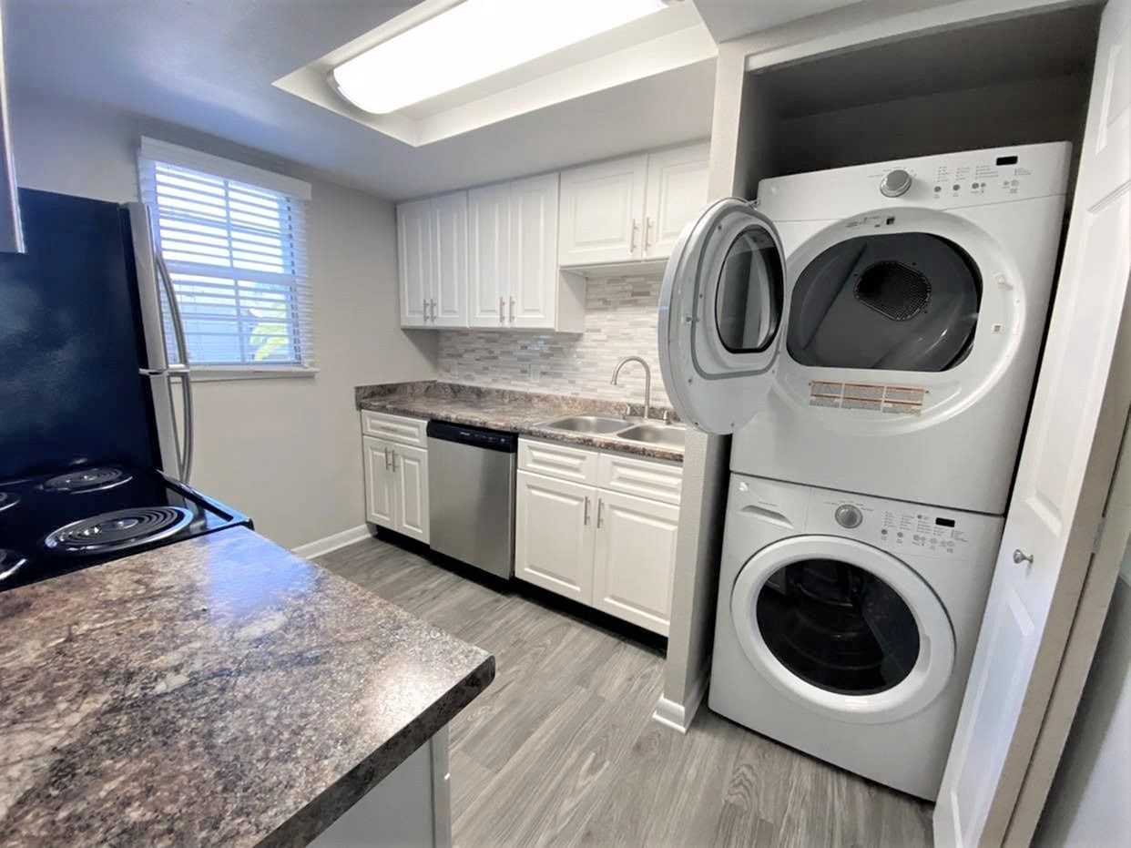 Kitchen with washer and dryer