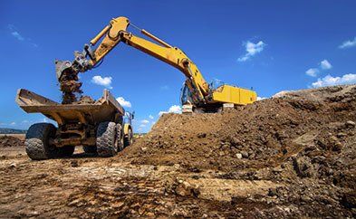 Excavator Loading Sand and Gravel - Construction Services in Seaside, OR