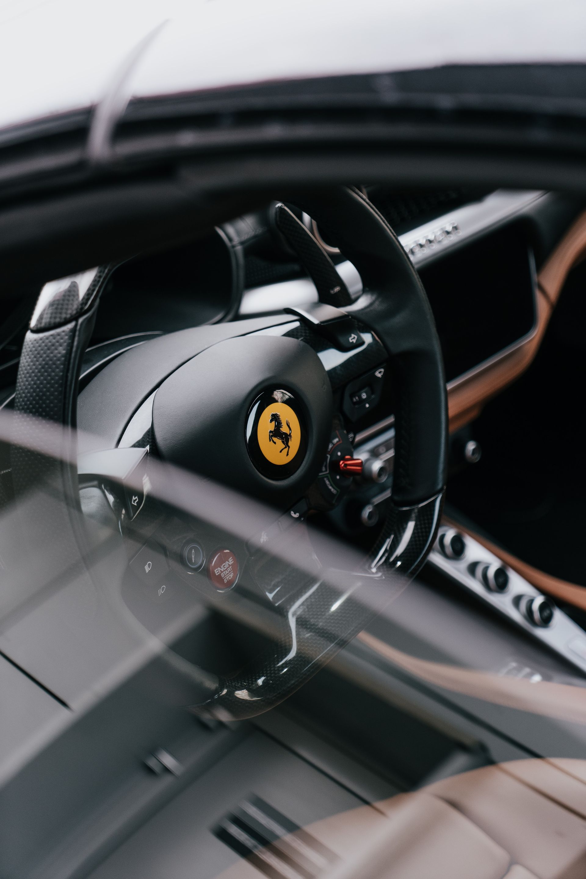 Steering wheel and interior of a Ferrari car.