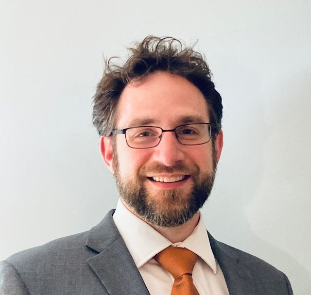 A close up of a rock covered in moss and lichen.