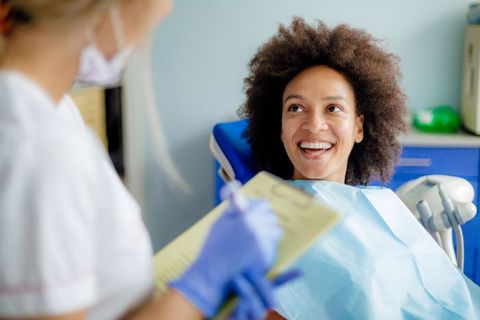 Woman having teeth examined at dentist — Wyoming, MI — Dental South
