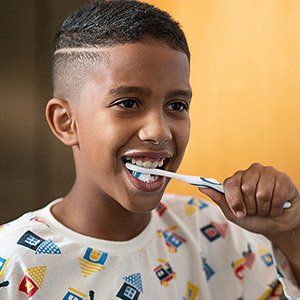 Boy brushing teeth — Wyoming, MI — Dental South
