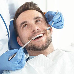 Dentist doing dental checkup — Wyoming, MI — Dental South