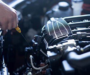 Car Mechanic Working in Auto Repair Service - Fuel and Emission Parts and Pumps in Bellflower, CA