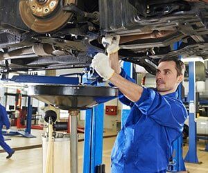 Mechanic Repairing the Suspension on a Car - Steering Components in Bellflower, CA