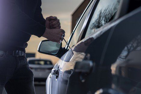 Vehicle Theft — A Guy Breaking A Side Mirror in Gardendale, AL