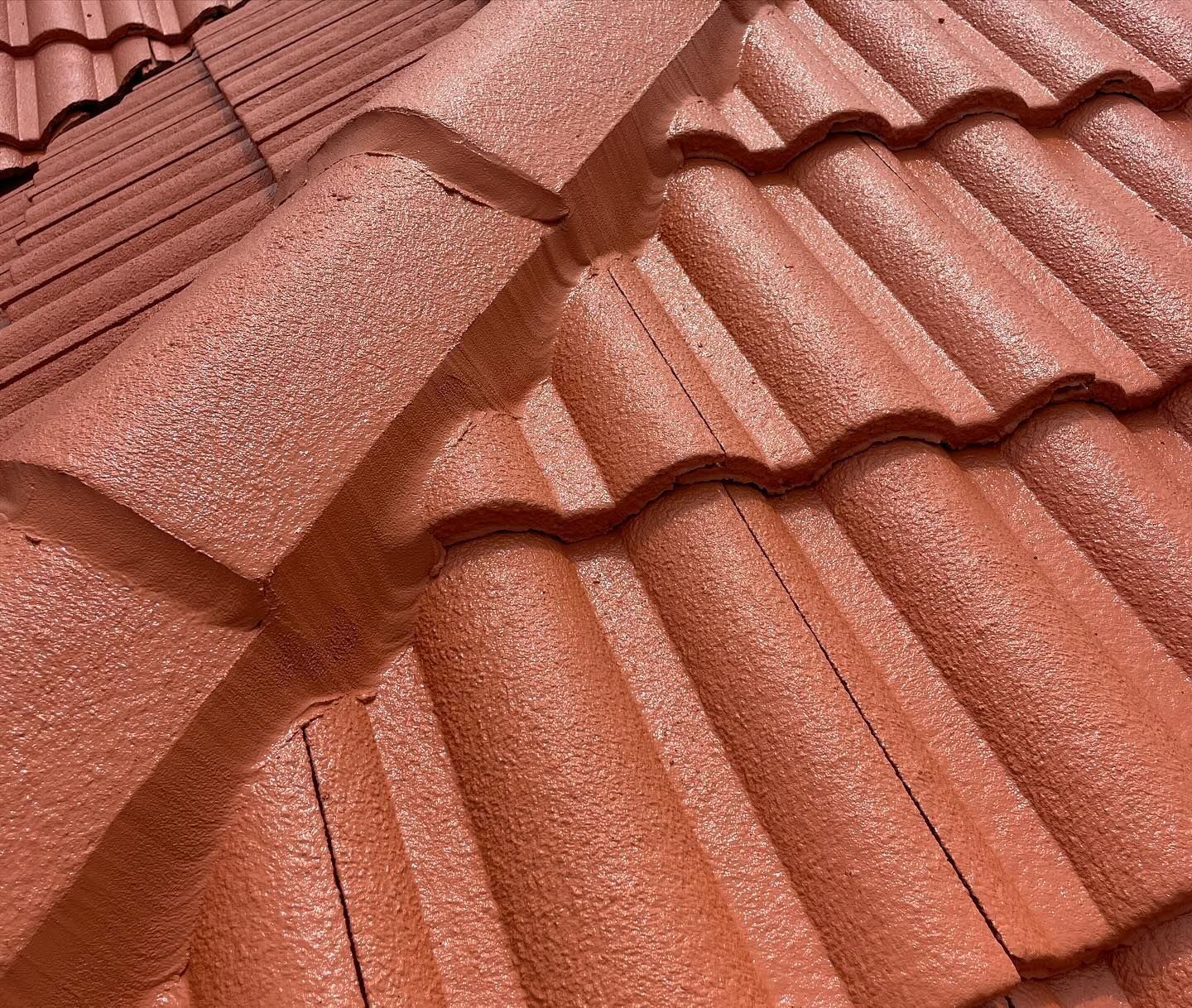 Close-up of a Terracotta-colored Roof With Textured, Curved Tiles — SEQ Roofing & Painting in Labrador, QLD