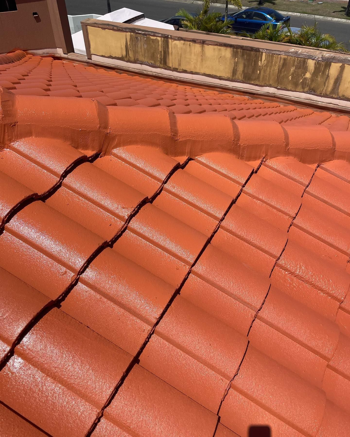 Red Tiled Roof in Sunlight — SEQ Roofing & Painting in Pacific Pines, QLD