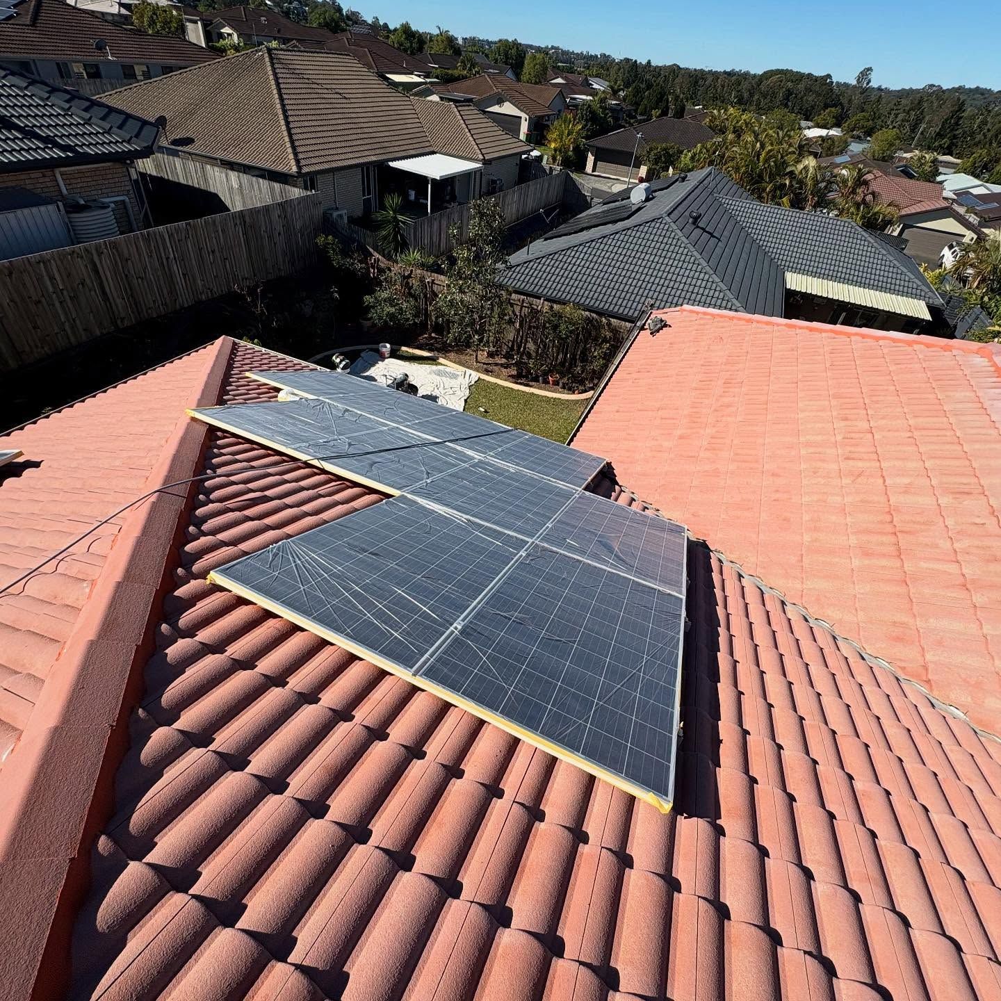 Solar Panels Installed on a Terracotta Tile Roof — SEQ Roofing & Painting in Surfers Paradise, QLD