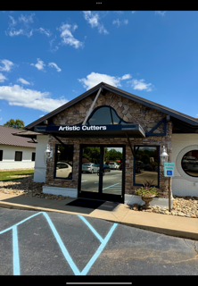 Brown door with chalkboard sign: 
