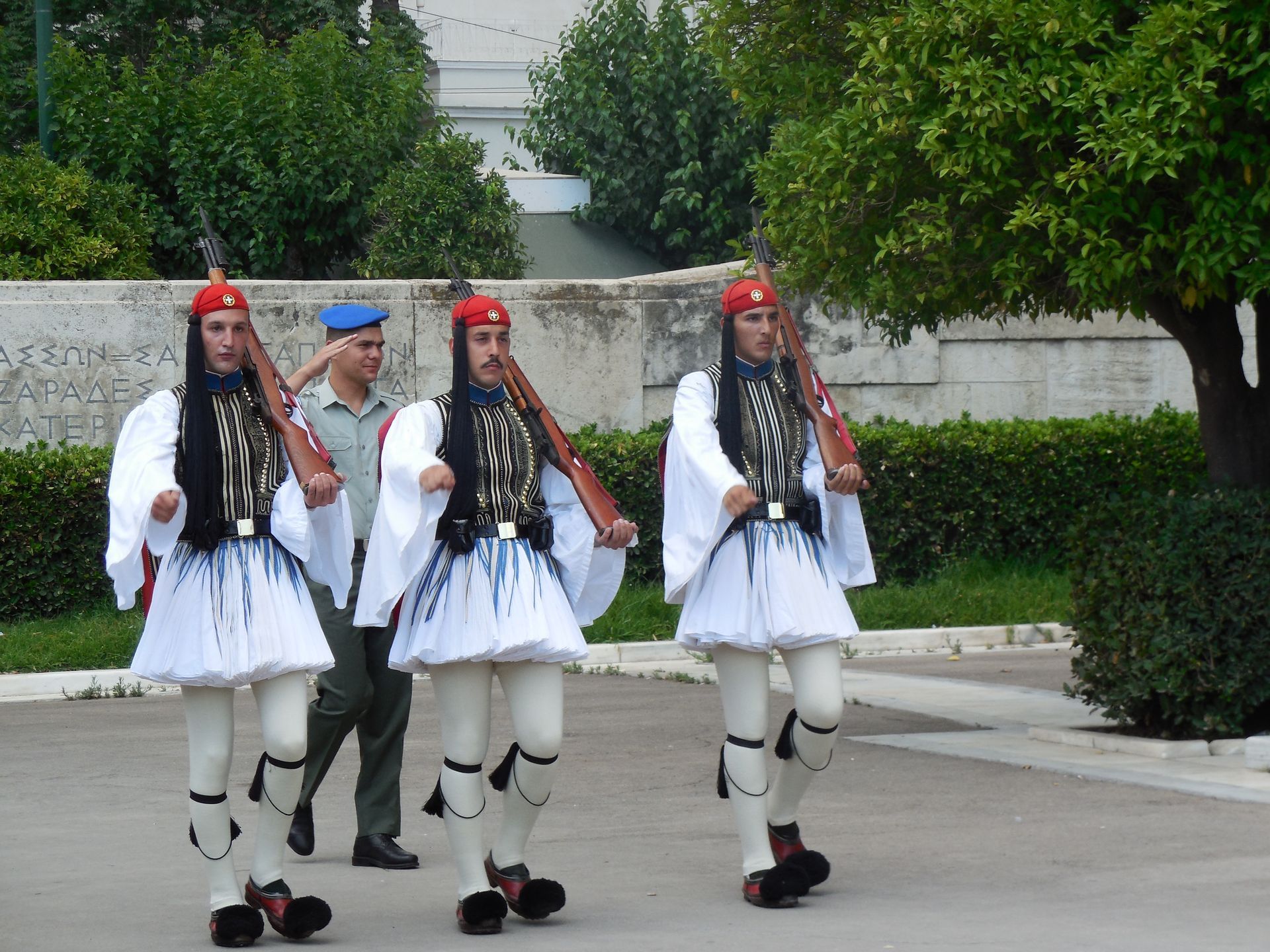 A castle is sitting on top of a rock in the middle of the ocean.