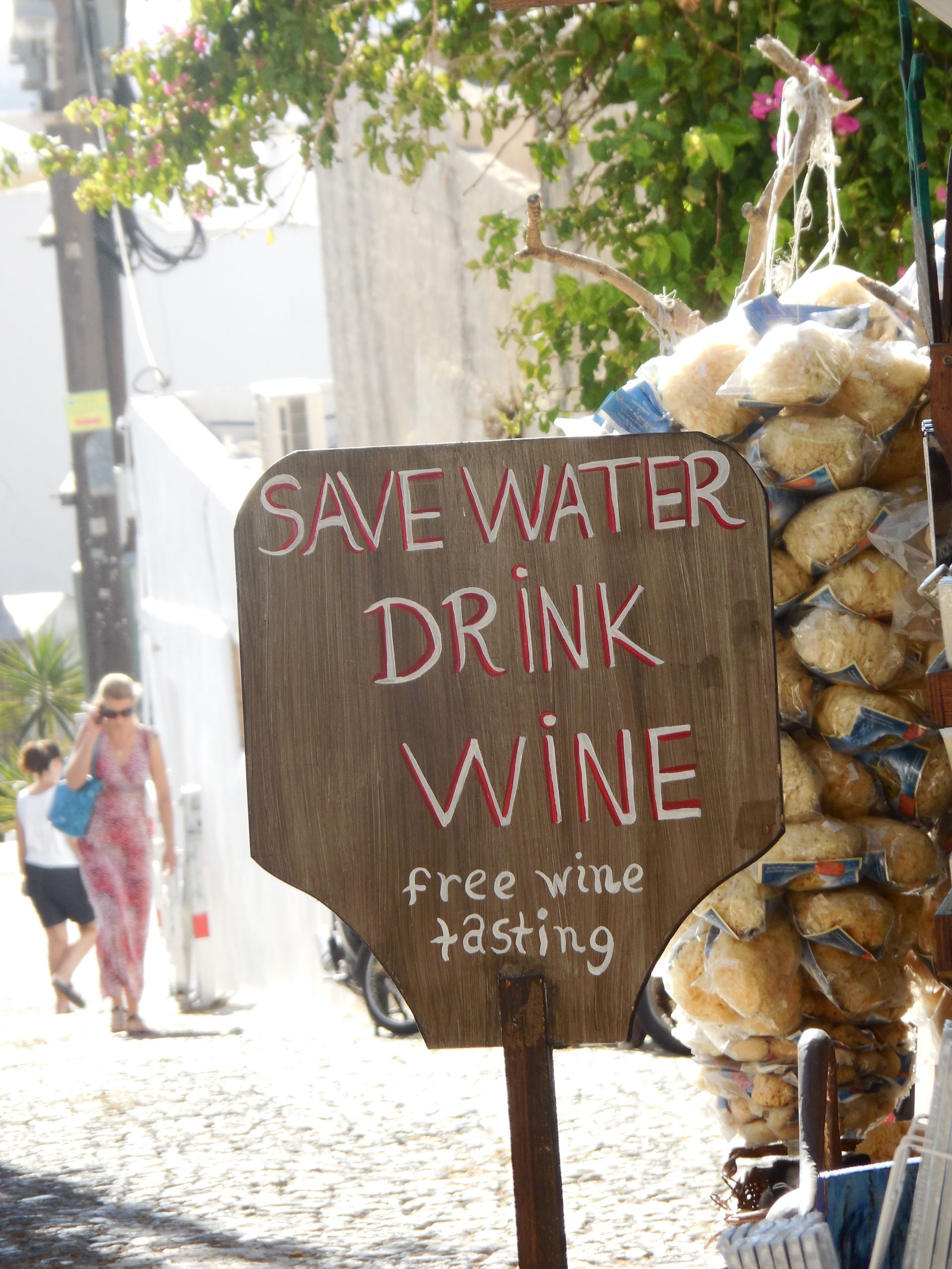 A backpack is sitting on a rock in the middle of a forest.