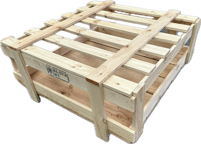 A wooden crate is sitting on a white surface.