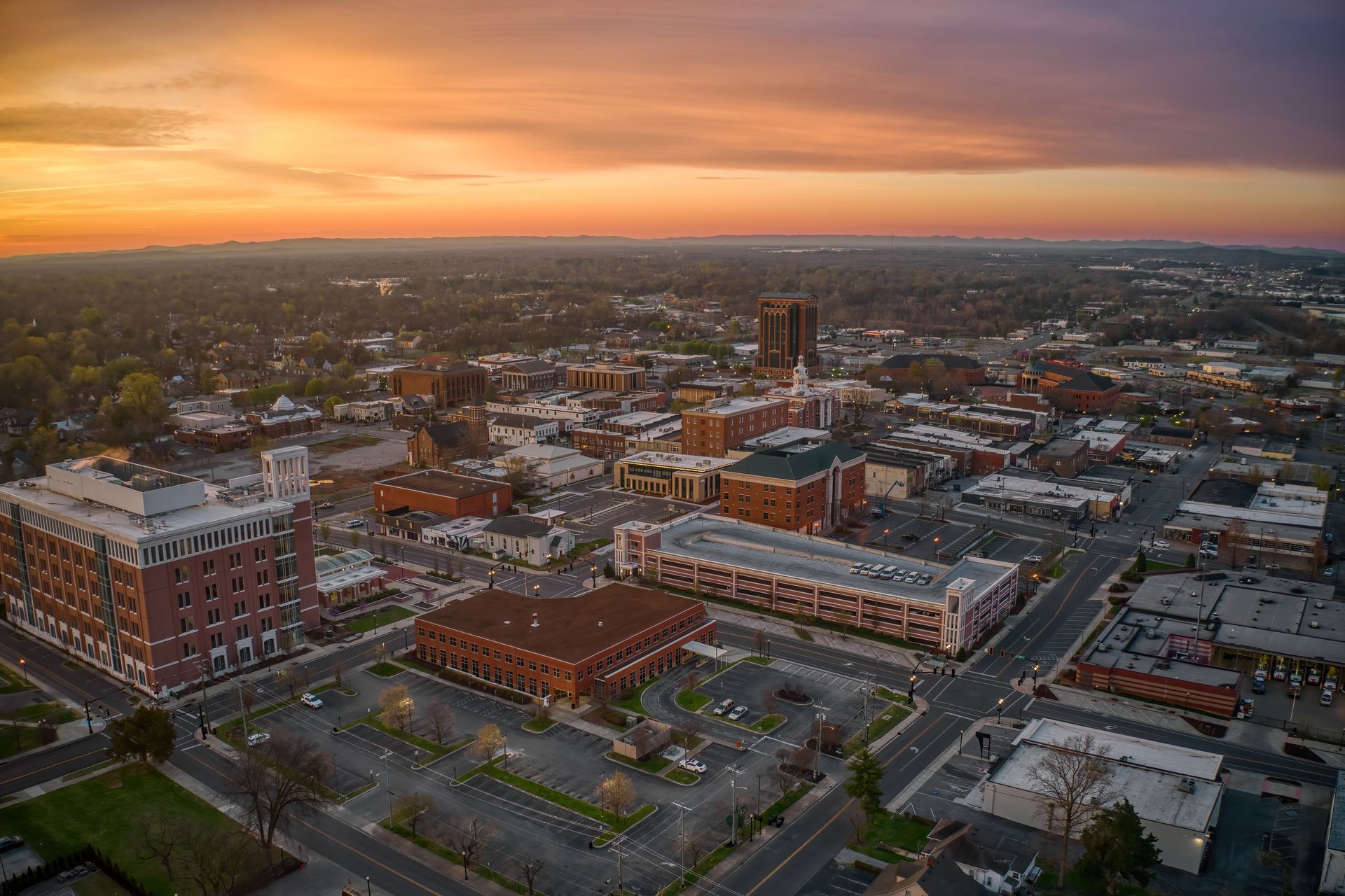 An aerial view of a small town at sunset.