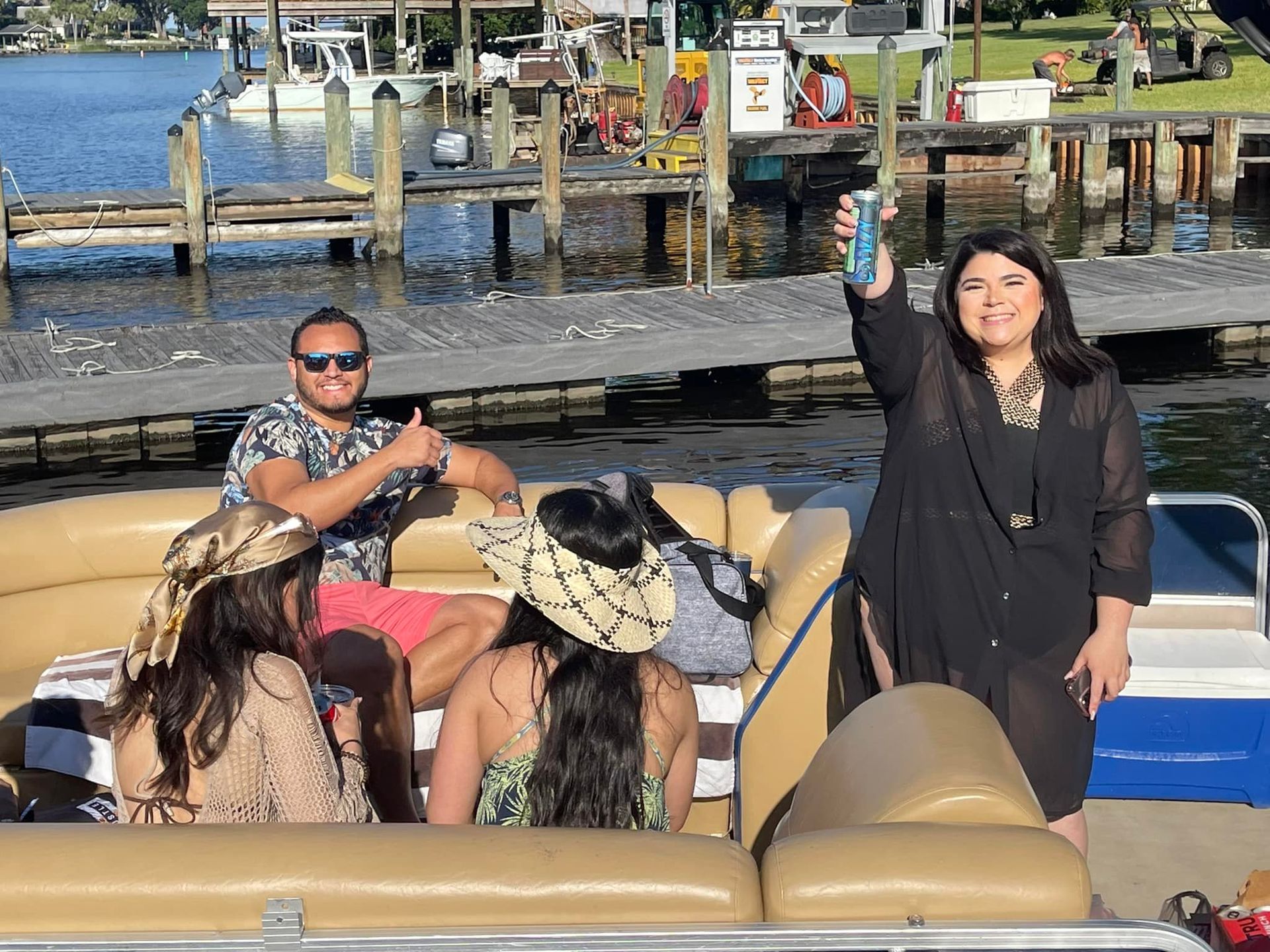 A group of people are sitting on a boat in the water.