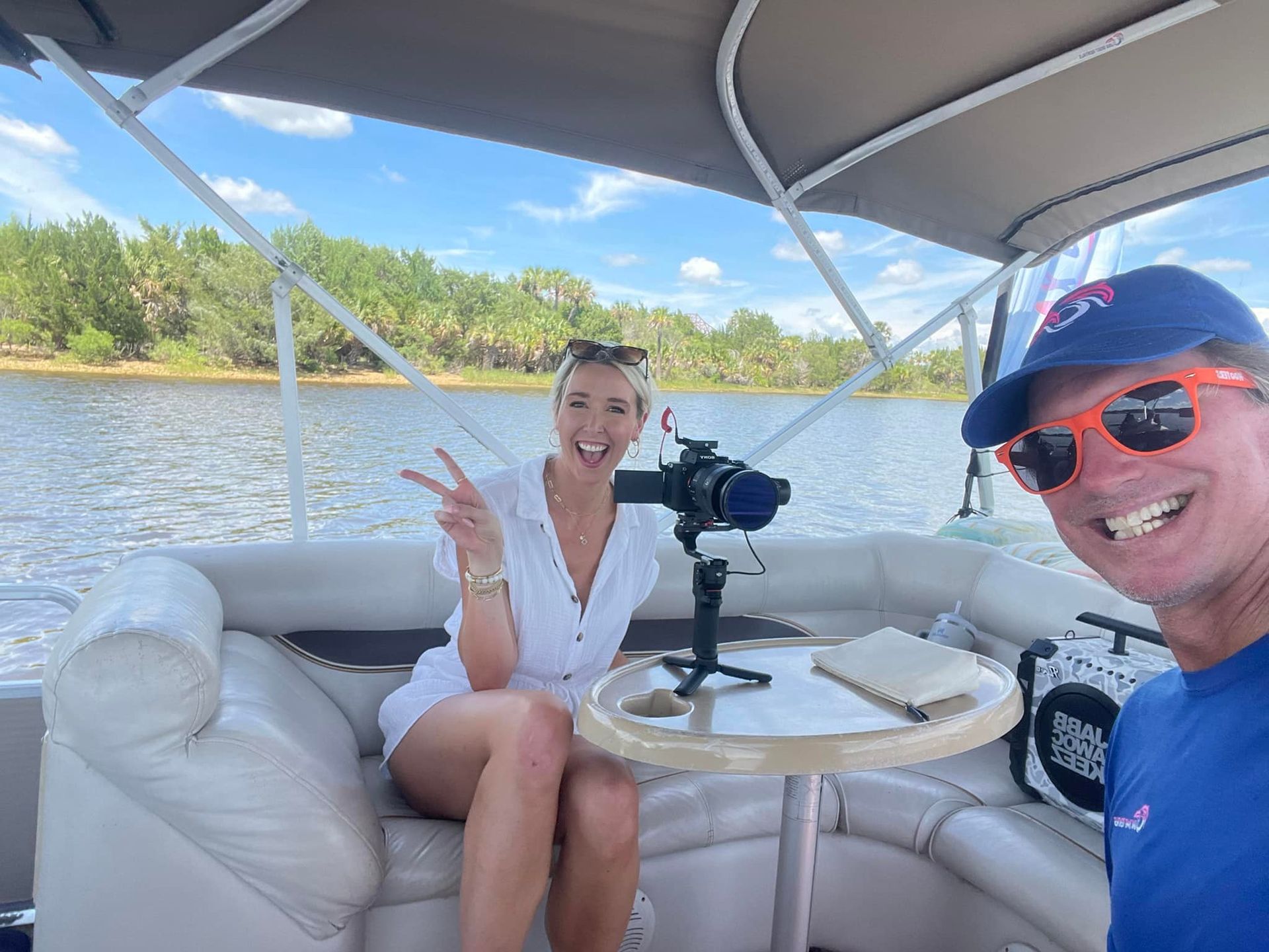 A man and a woman are sitting on a boat.