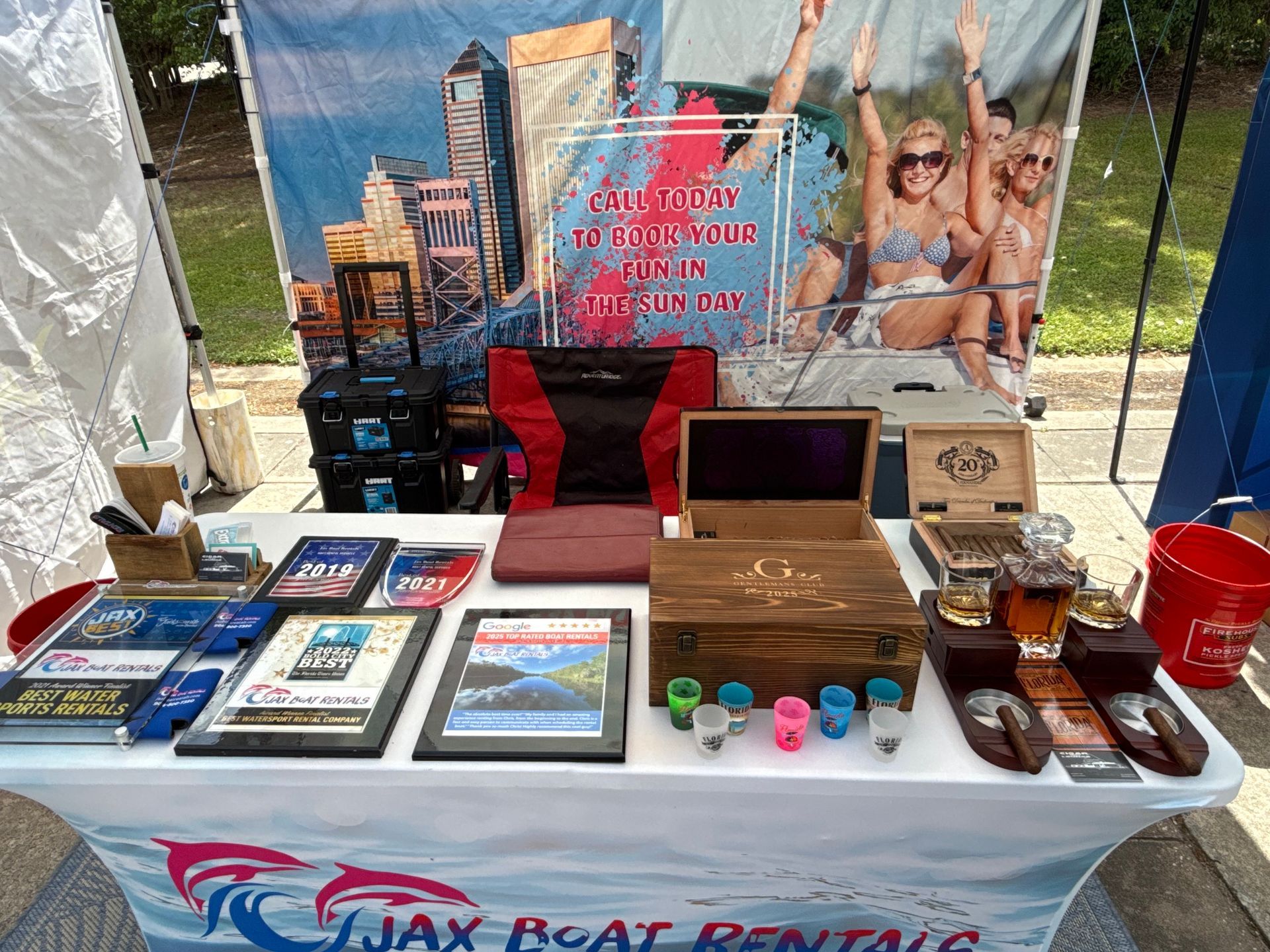 A table with a sign that says jax boat rentals on it