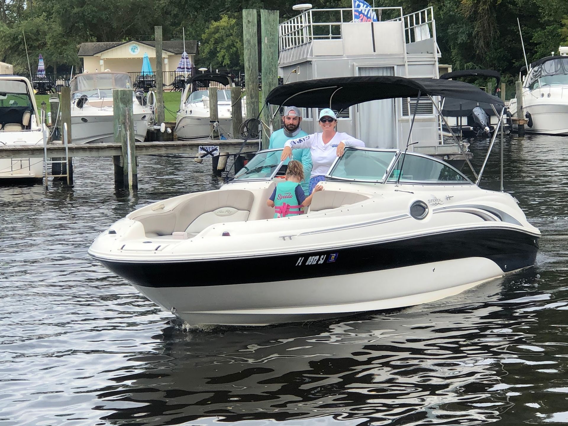 A group of people are riding on a boat in the water.