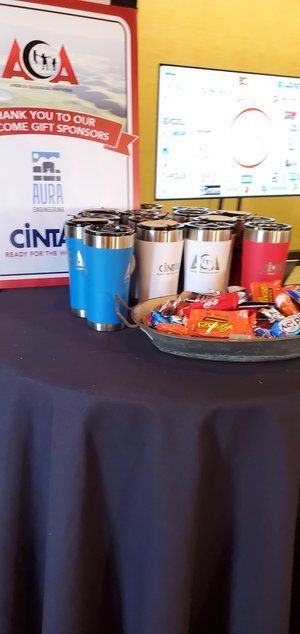 A table with a tray of snacks and cups on it.