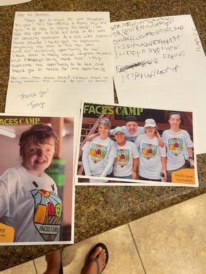 A group of people are standing next to each other on a table.