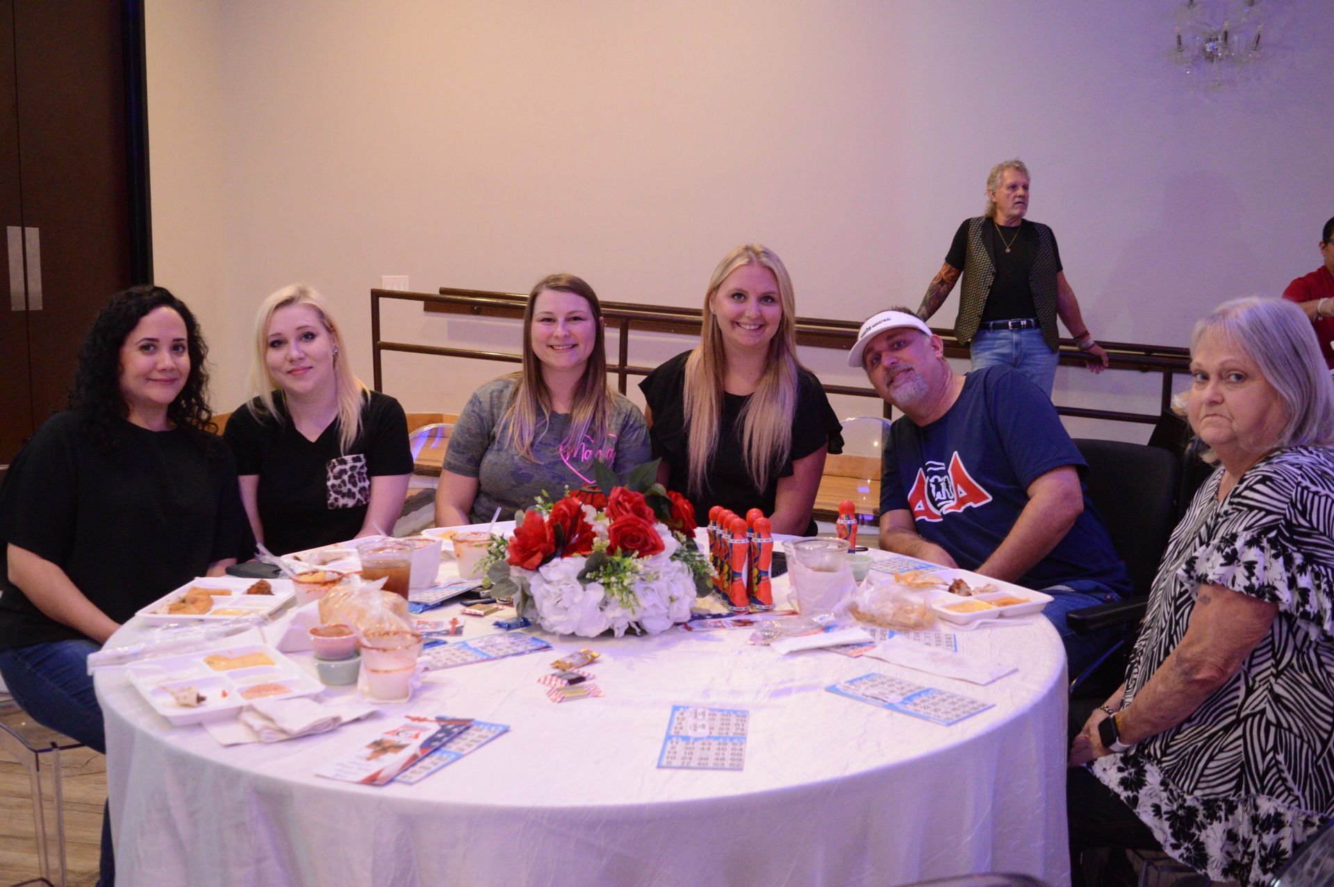 A group of people are sitting around a table.