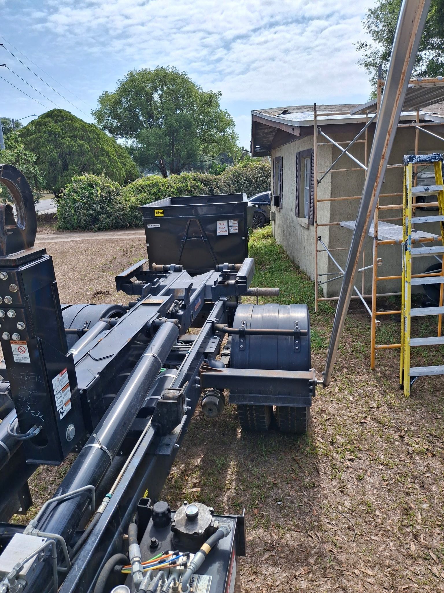 15‑yard dumpster placed for a shingle roofing project in Bartow, Florida
