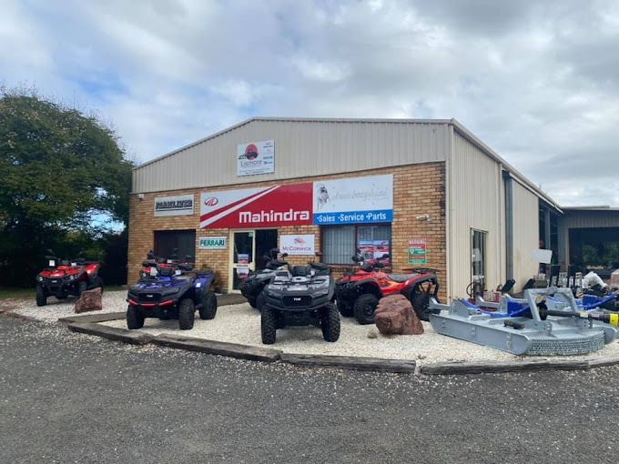 A mahindra ATV is parked in front of a building — Lismore Tractor & Machinery Centre in North Lismore, NSW